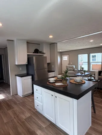 a kitchen with a sink and white cabinets