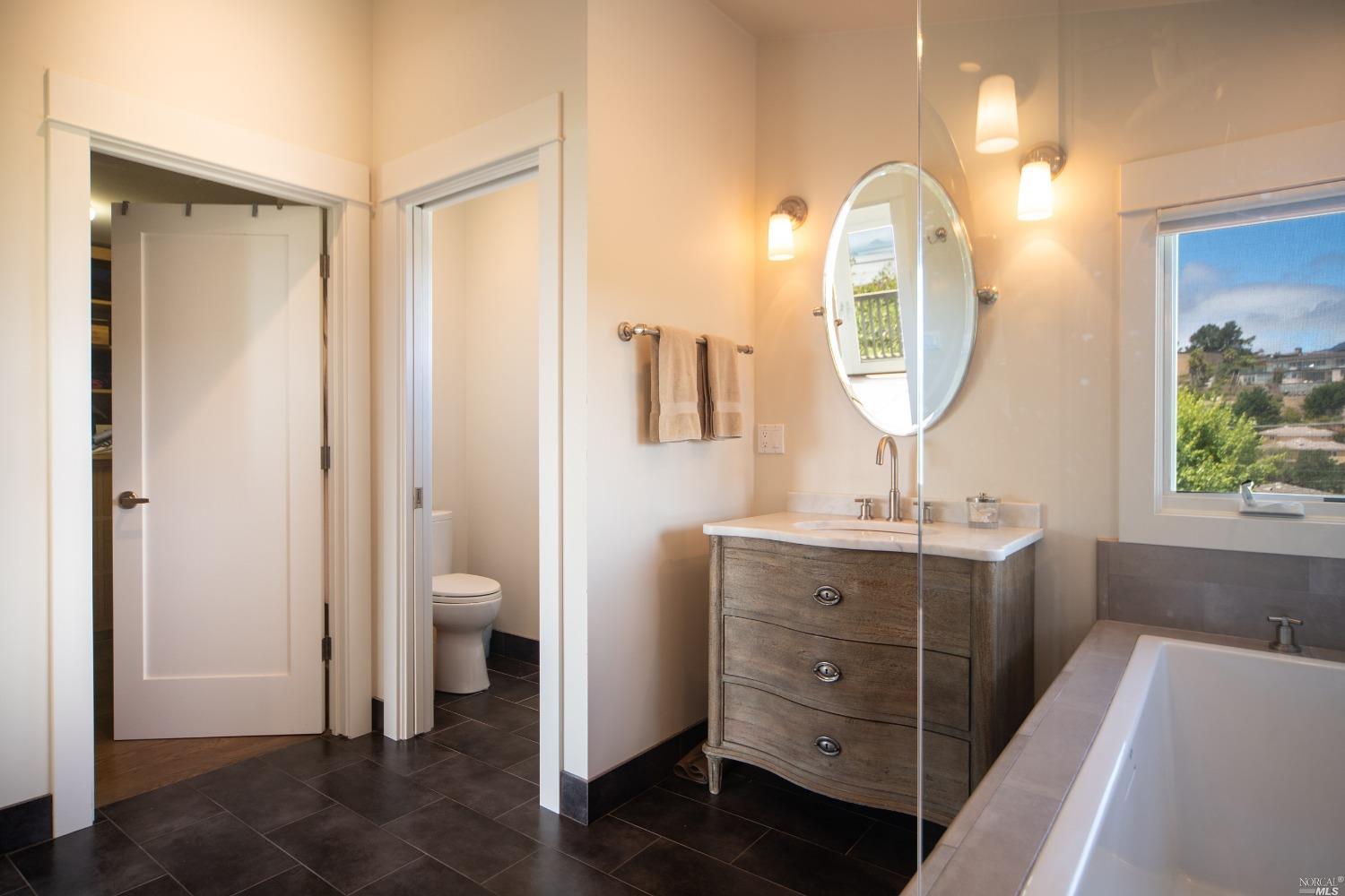 208 Reed Boulevard Mill Valley, CA 94941 - Photo 37 of 47 Separate, dual sinks, a large walk-in closet, and a private commode.