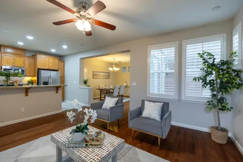 a kitchen with stainless steel appliances granite countertop a stove a refrigerator and a sink