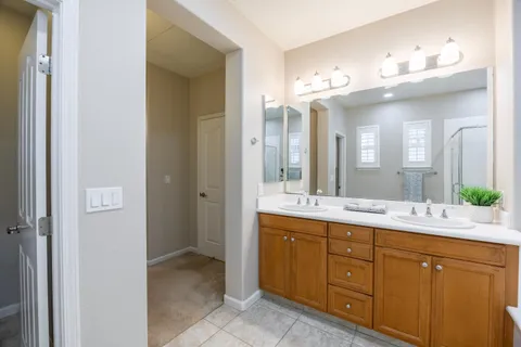 an empty room with a window and a ceiling fan