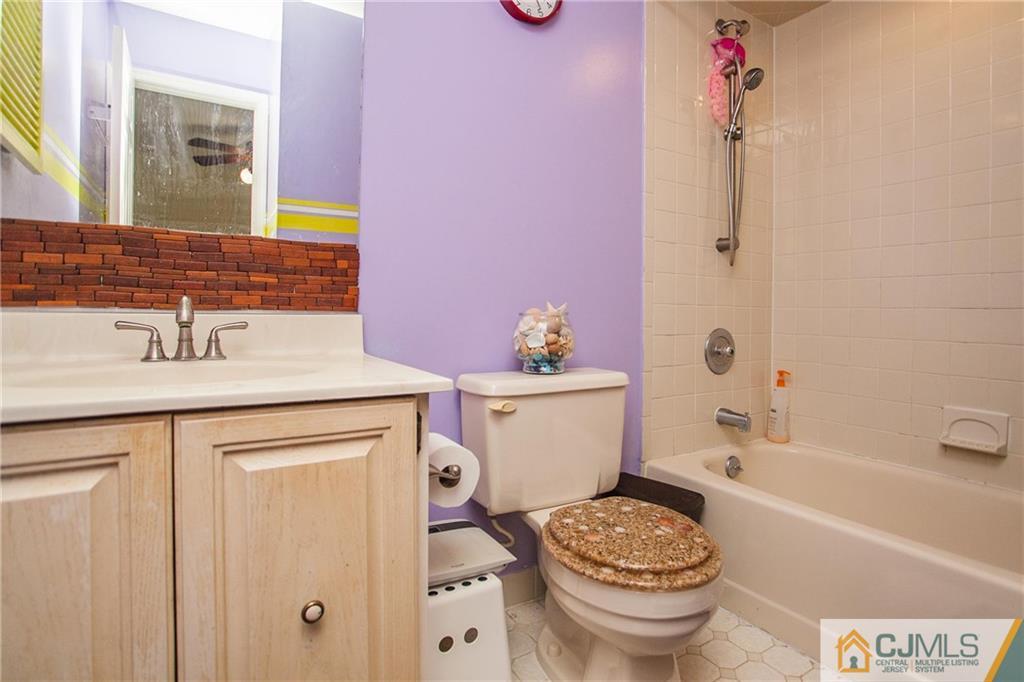 1006 Timber Oaks Road Edison, NJ 08820 - Photo 11 of 13 a bathroom with a sink toilet and shower