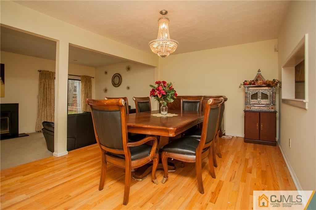 1006 Timber Oaks Road Edison, NJ 08820 - Photo 5 of 13 a dining room with furniture and wooden floor