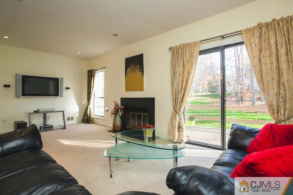 1006 Timber Oaks Road Edison, NJ 08820 - Photo 7 of 13 a living room with furniture and a flat screen tv