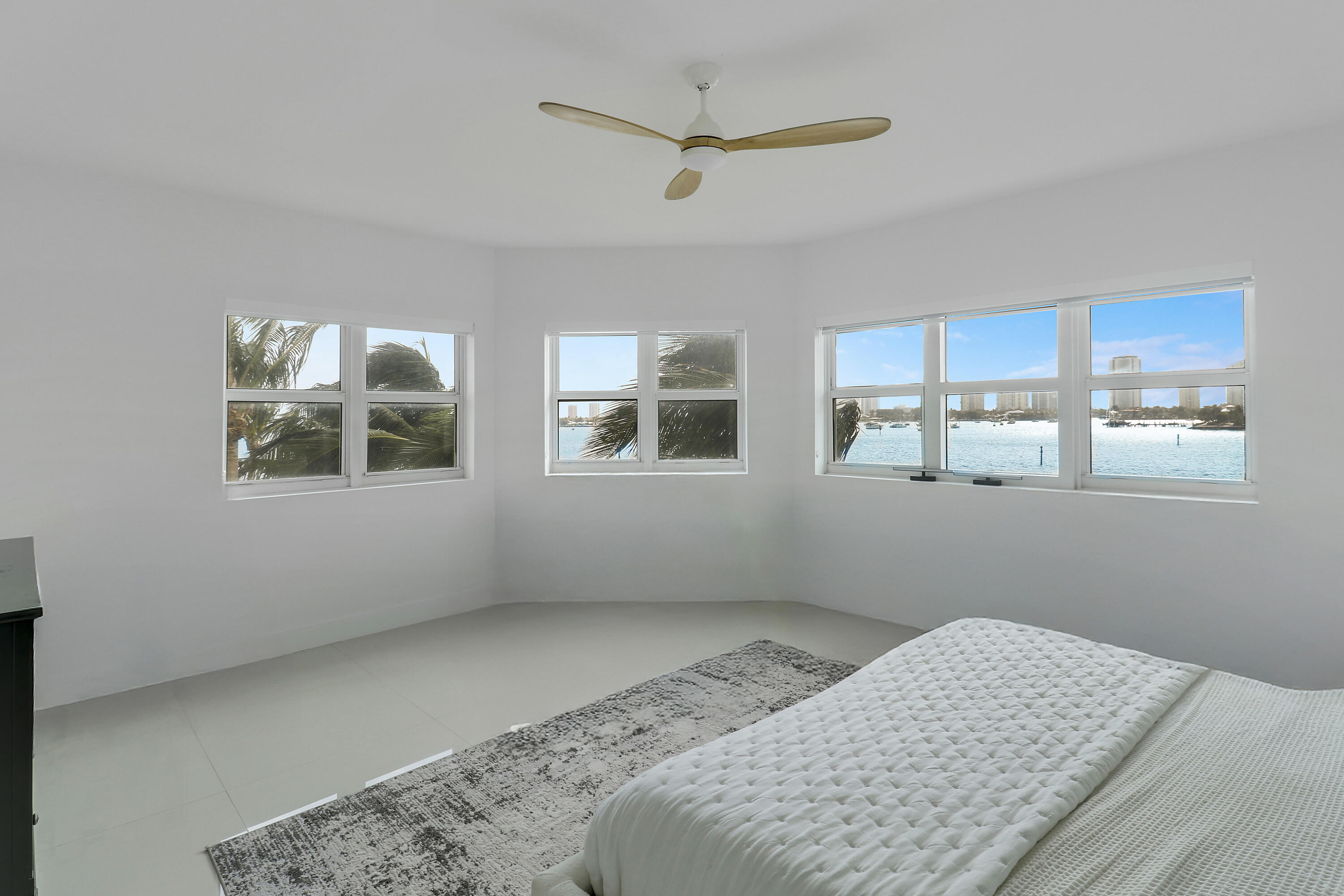 2640 Lake Shore Drive, Unit 307 Riviera Beach, FL 33404 - Photo 29 of 44 a bedroom with bed and a window