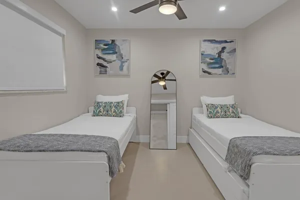 a bedroom with a bed and a couch