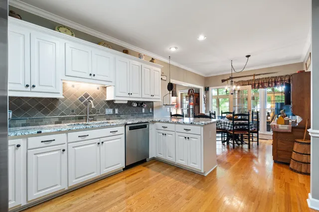 a room with furniture a rug and white walls