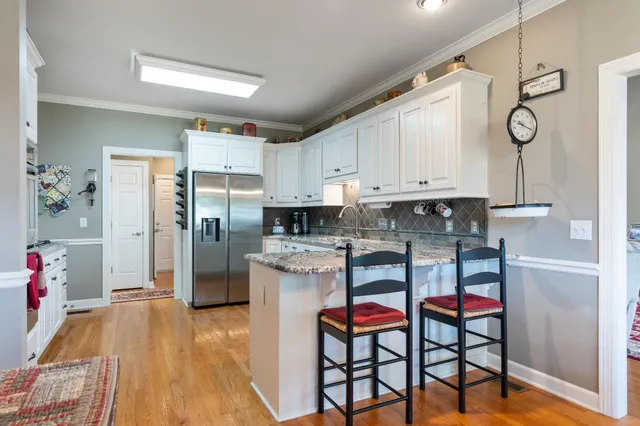 a view of a livingroom with furniture window and wooden floor