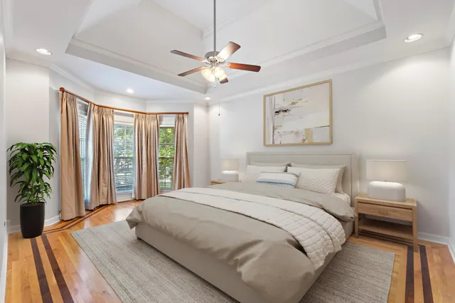 a view of a room with wooden floor fan and a window