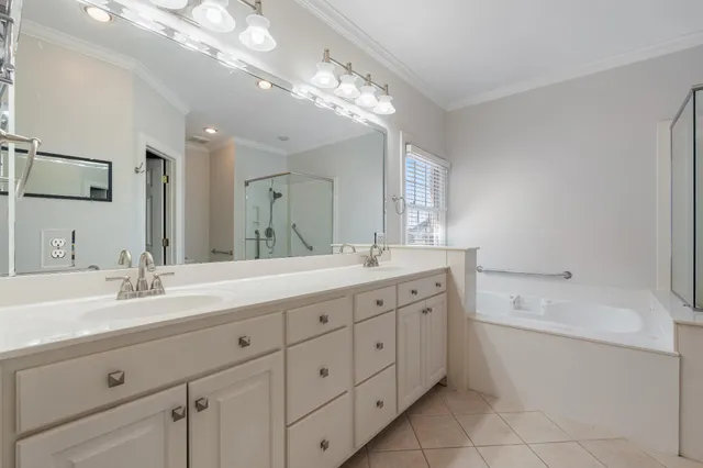 a spacious bathroom with a granite countertop sink a toilet and shower