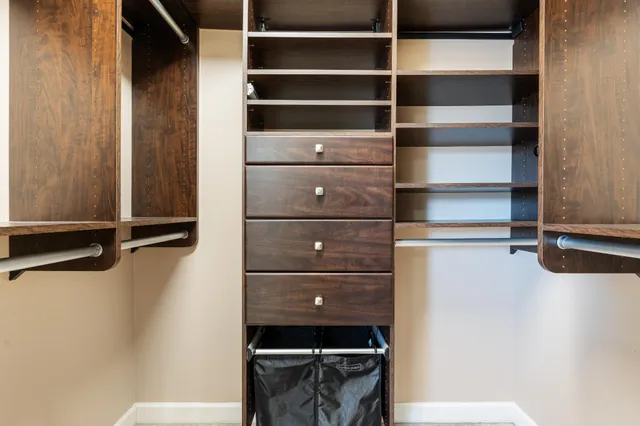 a bed room with a bed and a chandelier