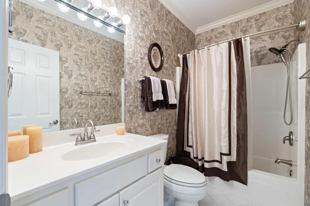 a living room with furniture a flat screen tv and a large window