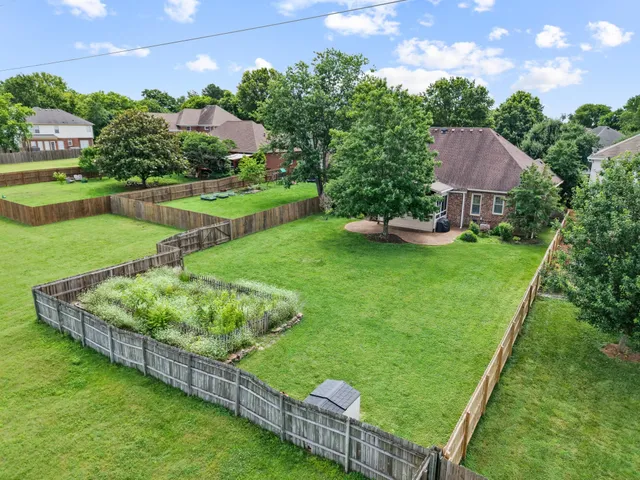 an aerial view of a house with a garden