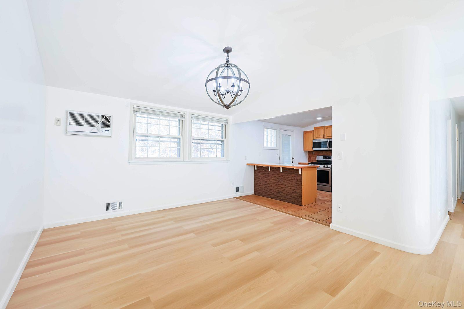 15 Mayflower Lane East Setauket, NY 11733 - Photo 10 of 23 a view of an empty room with a window