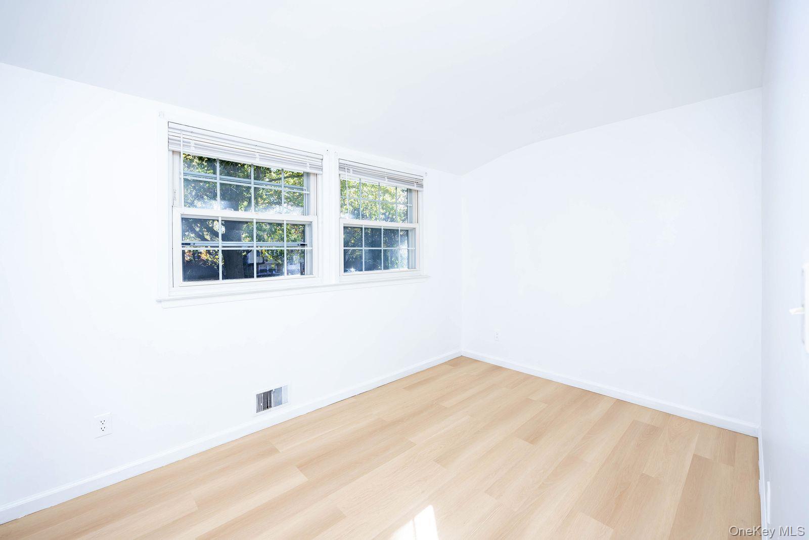 15 Mayflower Lane East Setauket, NY 11733 - Photo 11 of 23 a view of empty room with windows