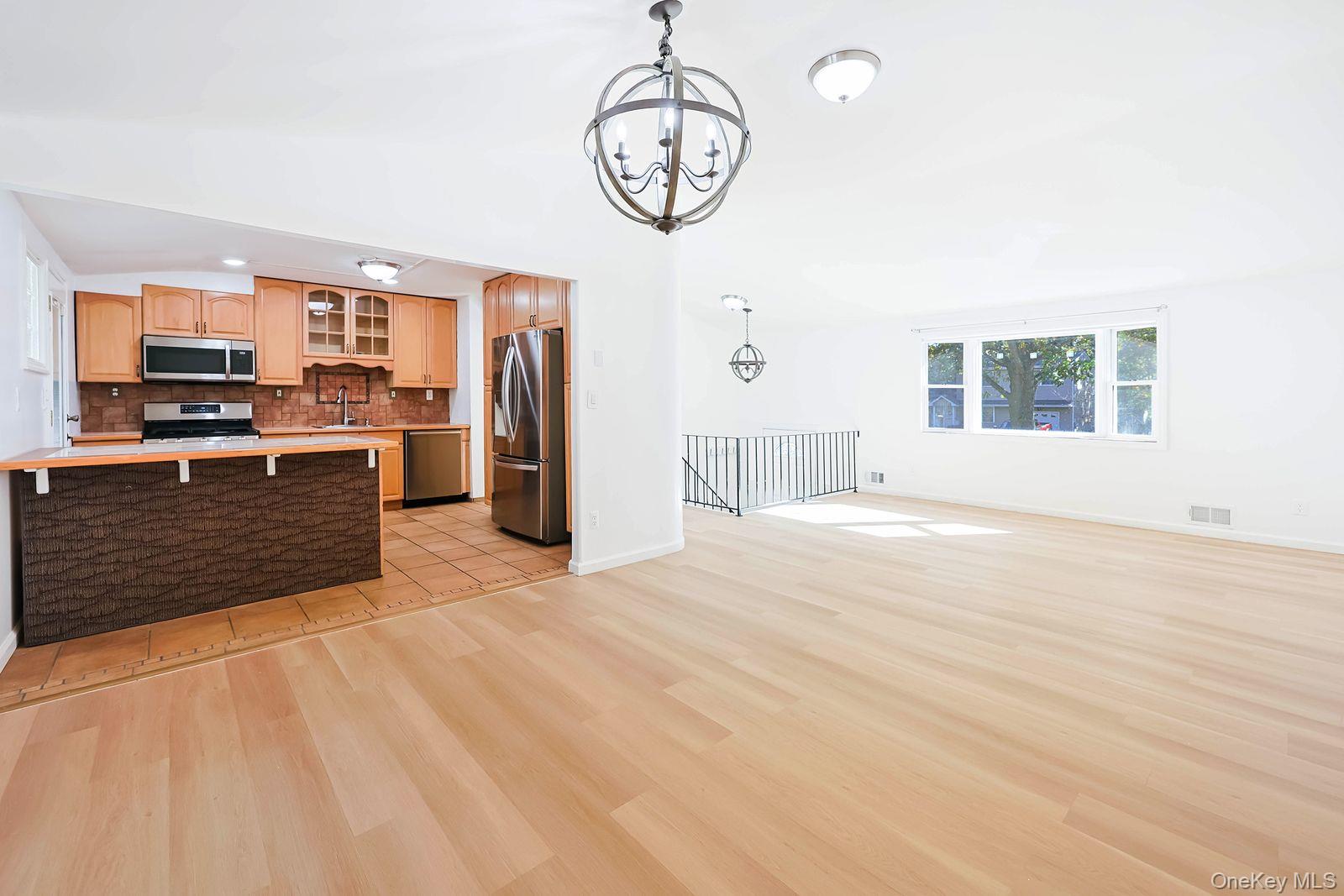 15 Mayflower Lane East Setauket, NY 11733 - Photo 23 of 23 a view of a kitchen with a sink cabinets and window