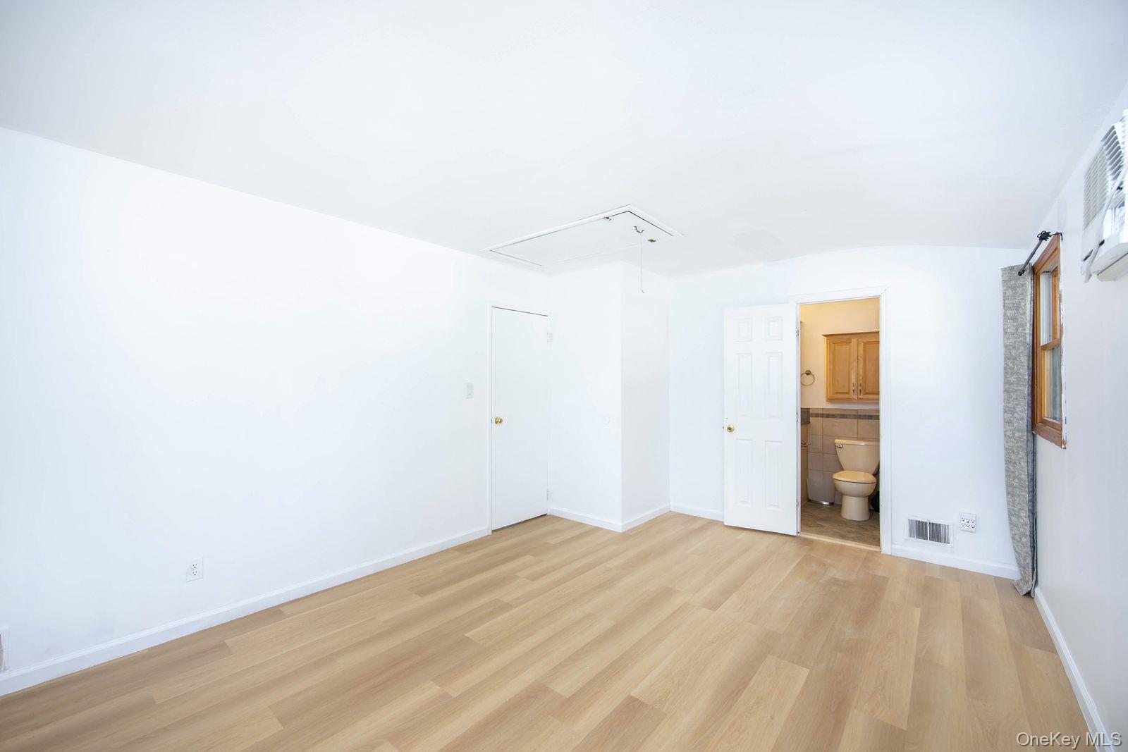 15 Mayflower Lane East Setauket, NY 11733 - Photo 8 of 23 a view of empty room with wooden floor