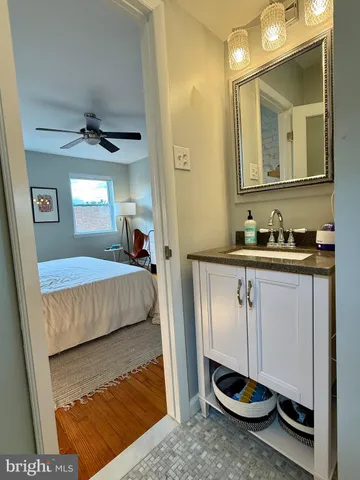 a bedroom with a bed and a mirror