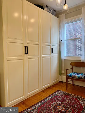 a view of a livingroom with kitchen and furniture