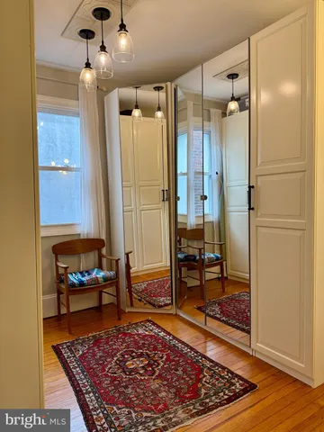 a living room with a rug and a rug