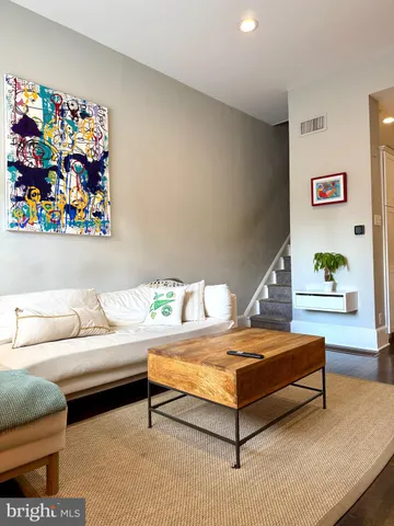 a living room with furniture and a couch