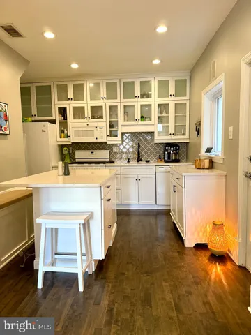 a kitchen with stainless steel appliances granite countertop a stove and a sink