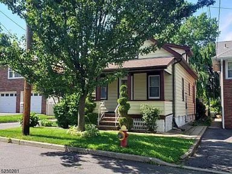 138 Bergen Avenue Clifton, NJ 07011 - Photo 1 of 1 a front view of a house with a yard