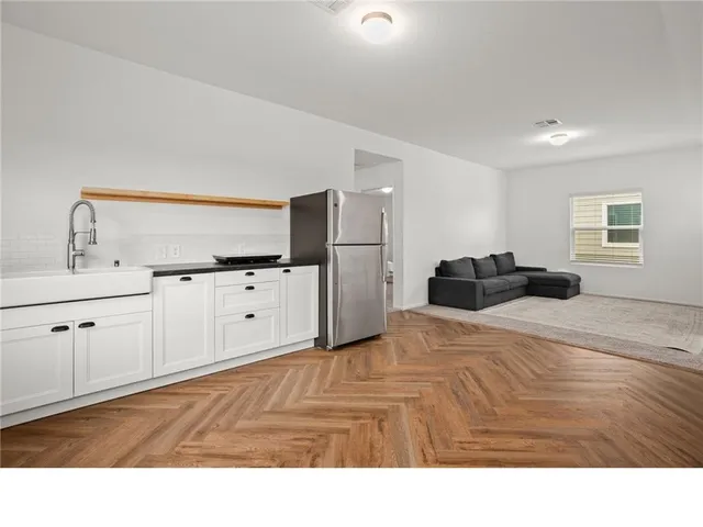 a room with a bed and mirror