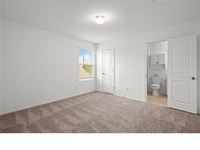 a room with a window and a bathroom