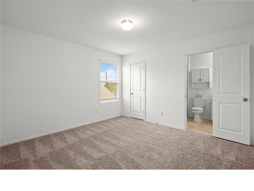 328 Majestic Cedar Court Liberty Hill, TX 78642 - Photo 27 of 31 a room with a window and a bathroom