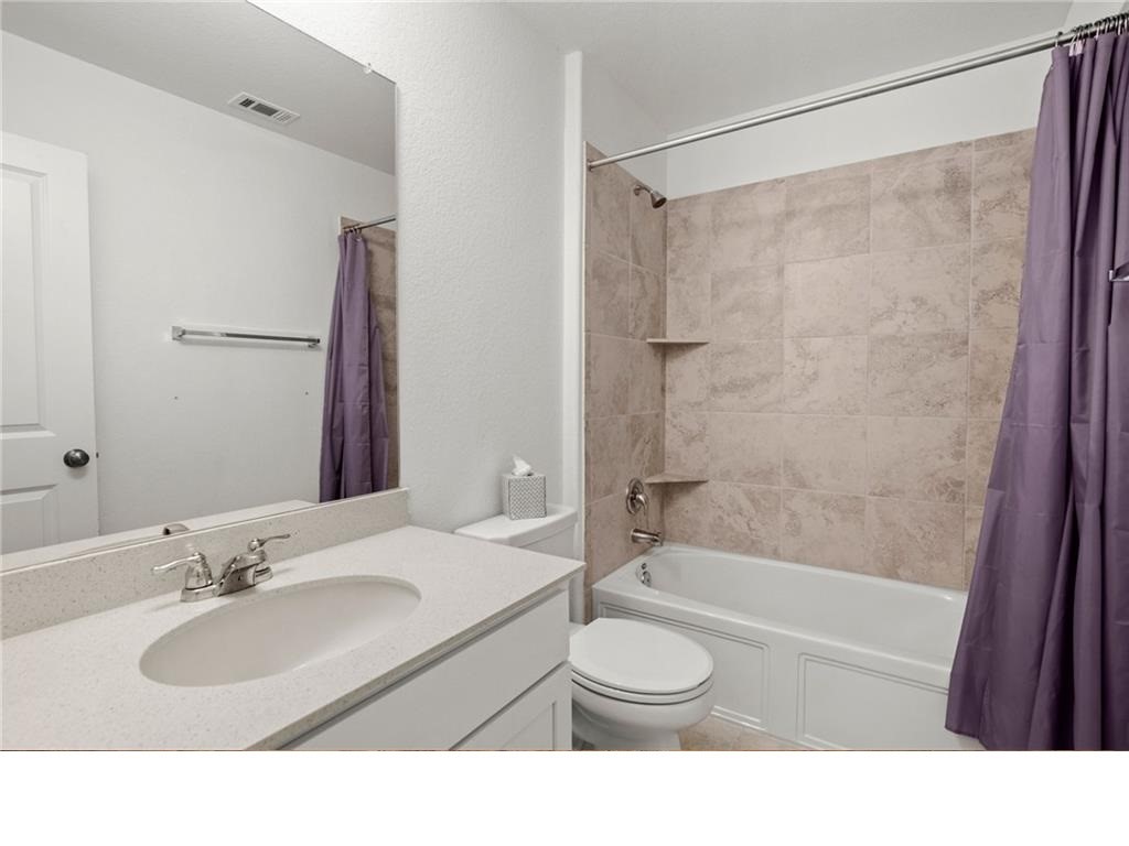 328 Majestic Cedar Court Liberty Hill, TX 78642 - Photo 29 of 31 a bathroom with a sink a toilet and shower