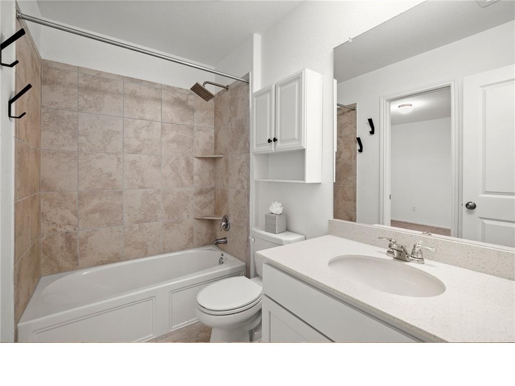 328 Majestic Cedar Court Liberty Hill, TX 78642 - Photo 30 of 31 a bathroom with a sink toilet and shower