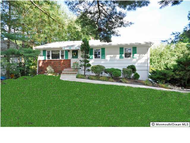 72 Middlesex Road Matawan, NJ 07747 - Photo 1 of 3 a house view with a garden space