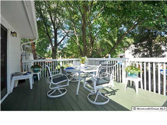 72 Middlesex Road Matawan, NJ 07747 - Photo 2 of 3 a view of a patio with a table chairs and a table