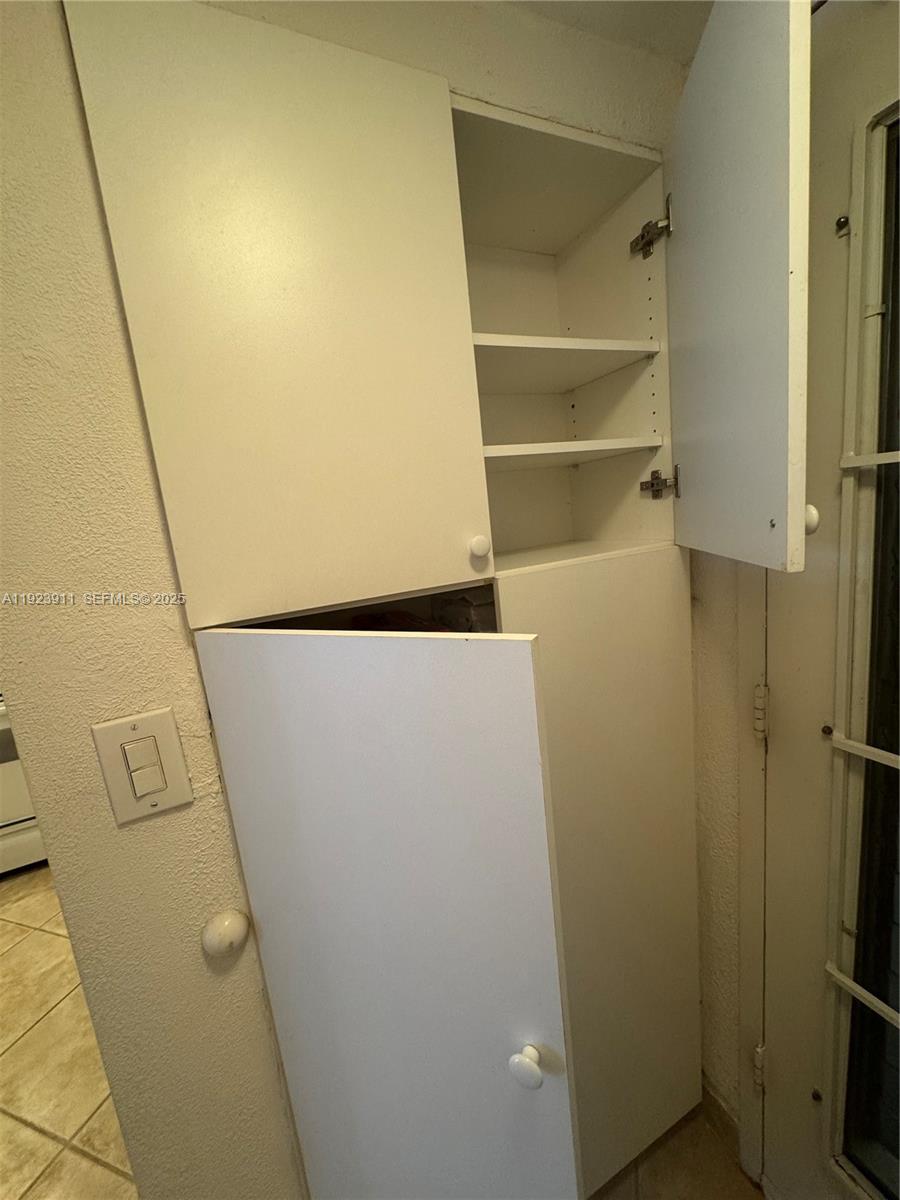 400 North Surf Road, Unit RGB Hollywood, FL 33019 - Photo 11 of 17 a view of walk in closet with empty racks