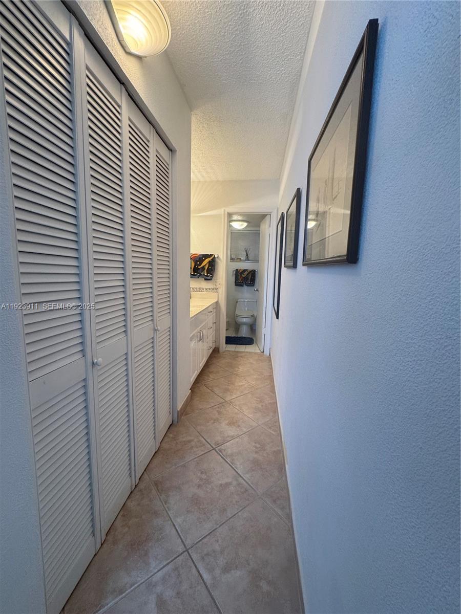 400 North Surf Road, Unit RGB Hollywood, FL 33019 - Photo 13 of 17 a view of a hallway with entryway and wooden floor