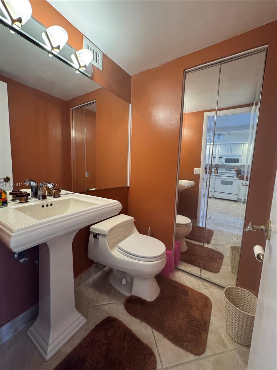 400 North Surf Road, Unit RGB Hollywood, FL 33019 - Photo 14 of 17 a bathroom with a sink and a mirror