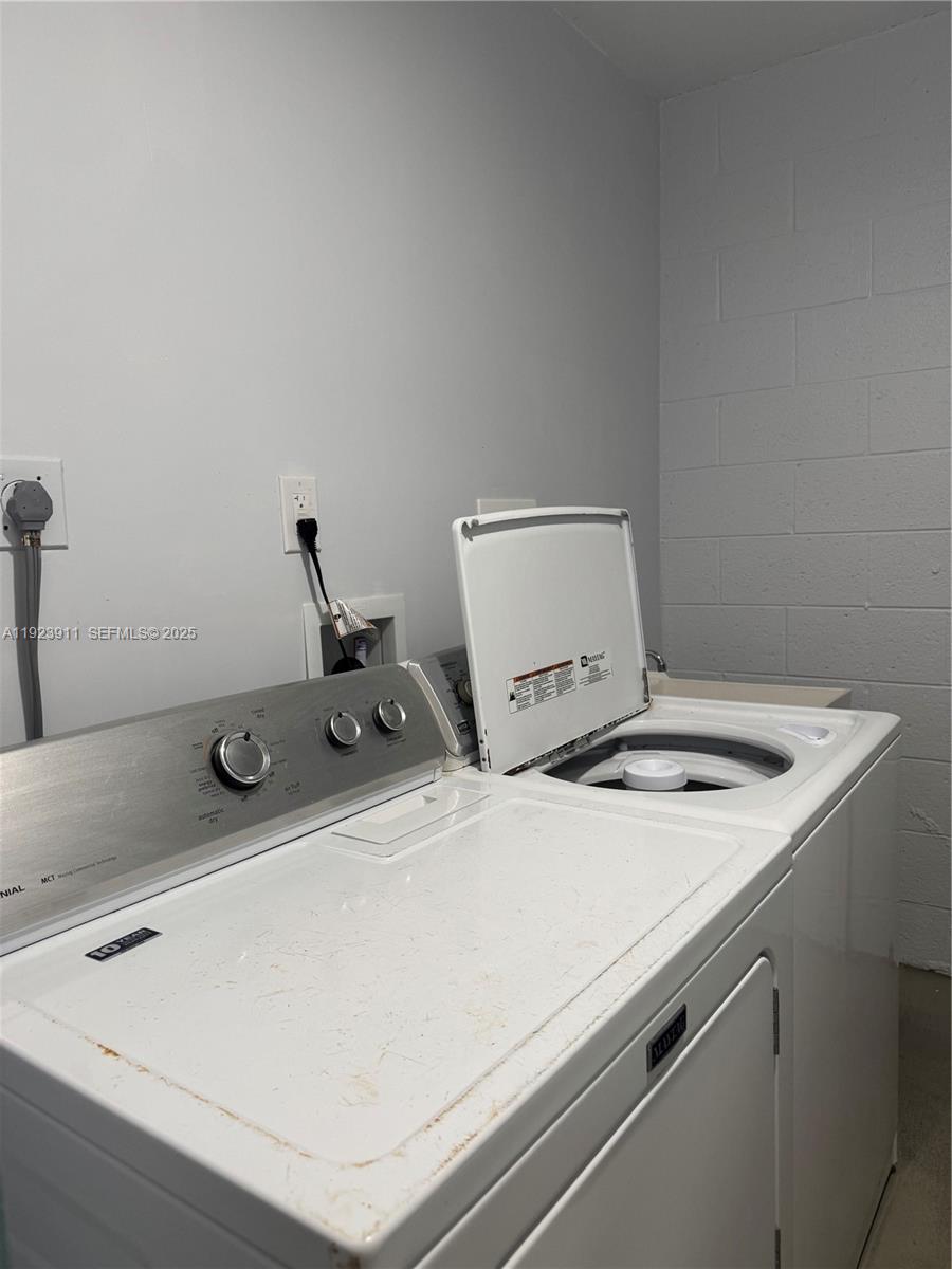 400 North Surf Road, Unit RGB Hollywood, FL 33019 - Photo 16 of 17 a utility room with dryer and washer