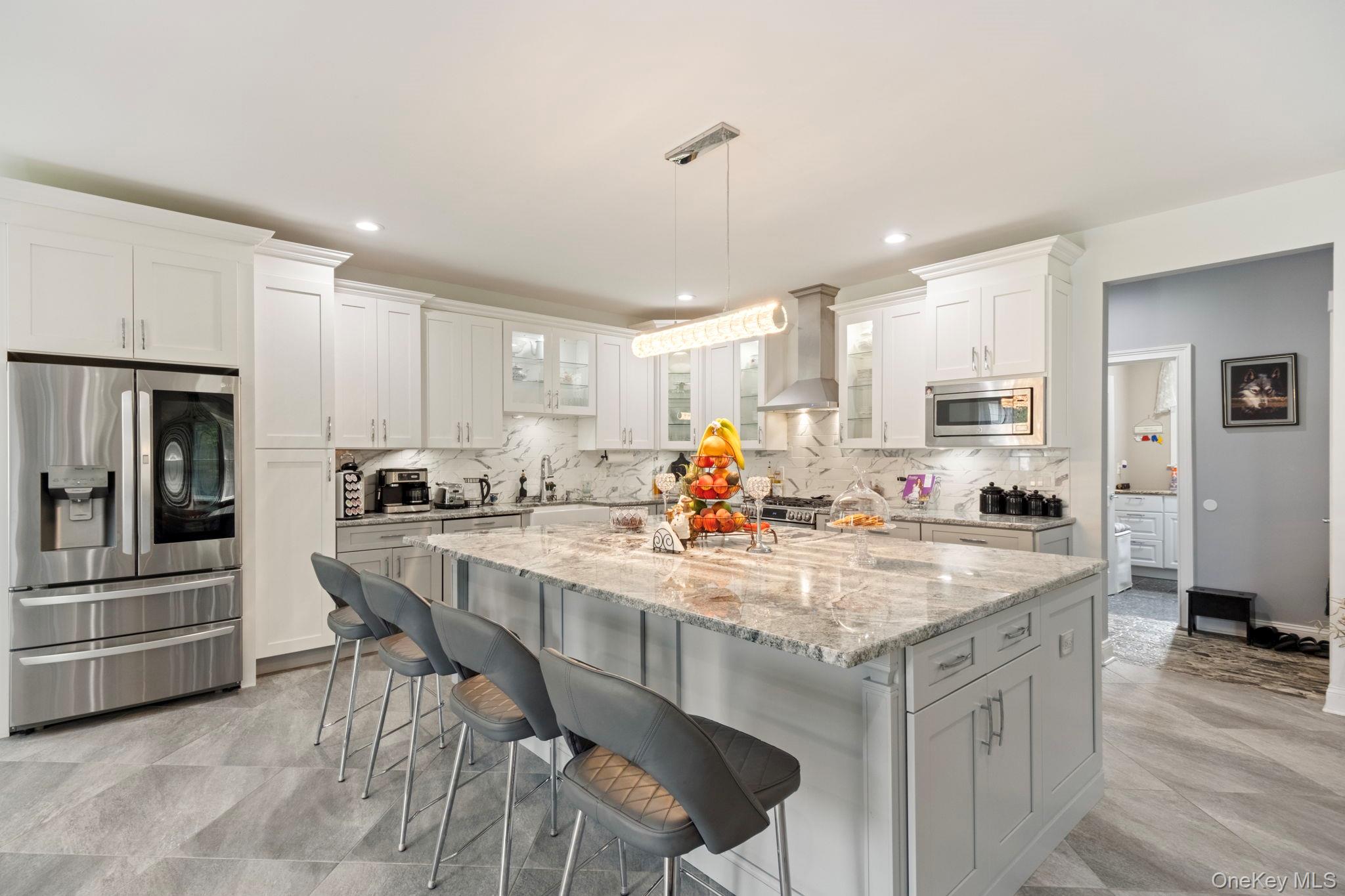 174 Webber Road Coxsackie, NY 12058 - Photo 16 of 50 a kitchen with stainless steel appliances granite countertop a table chairs sink and cabinets