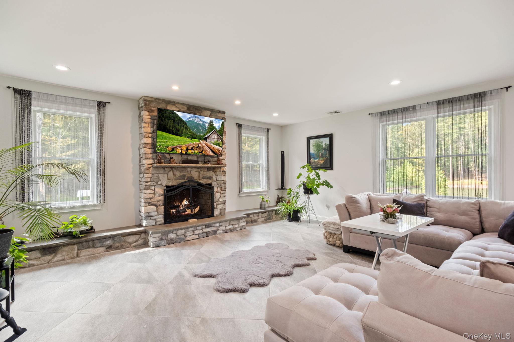 174 Webber Road Coxsackie, NY 12058 - Photo 18 of 50 a living room with furniture fireplace and window
