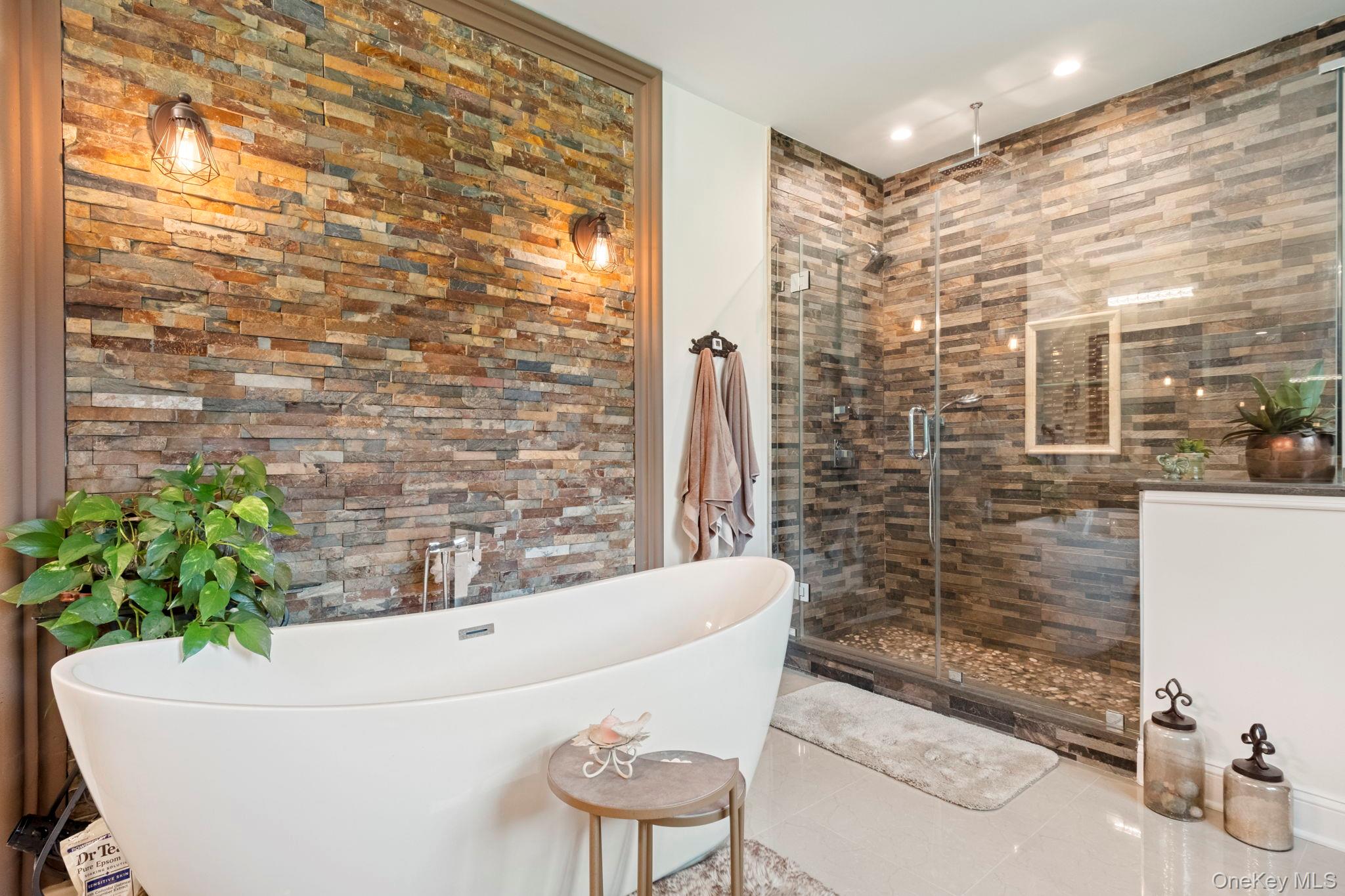 174 Webber Road Coxsackie, NY 12058 - Photo 32 of 50 a bath tub sitting in a bathroom next to a blue wall