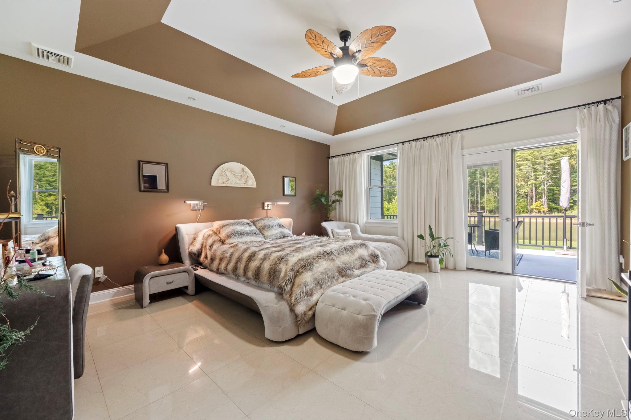 174 Webber Road Coxsackie, NY 12058 - Photo 34 of 50 a spacious bedroom with a bed couch and a large window