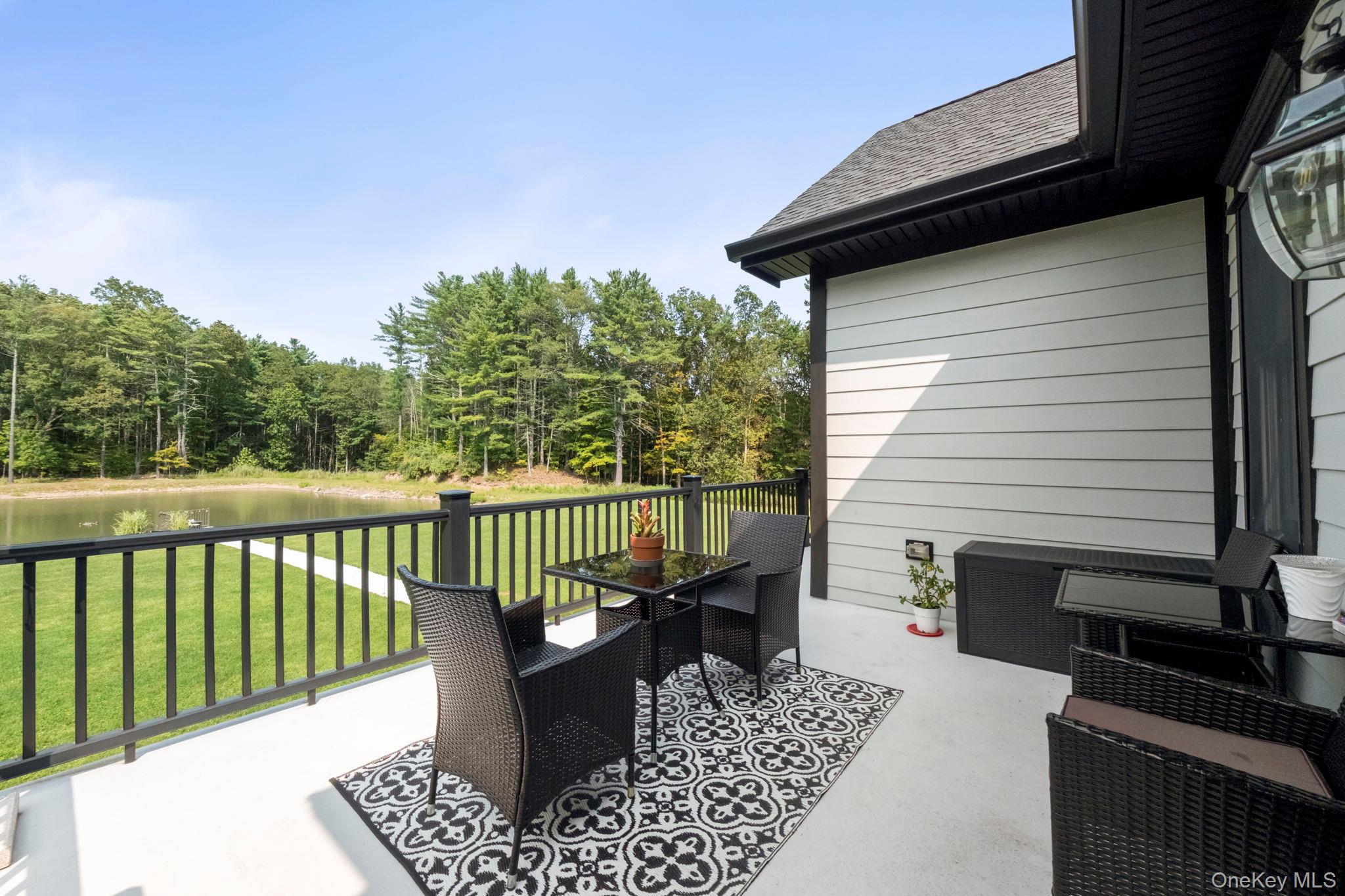 174 Webber Road Coxsackie, NY 12058 - Photo 40 of 50 a view of balcony with wooden floor and seating space