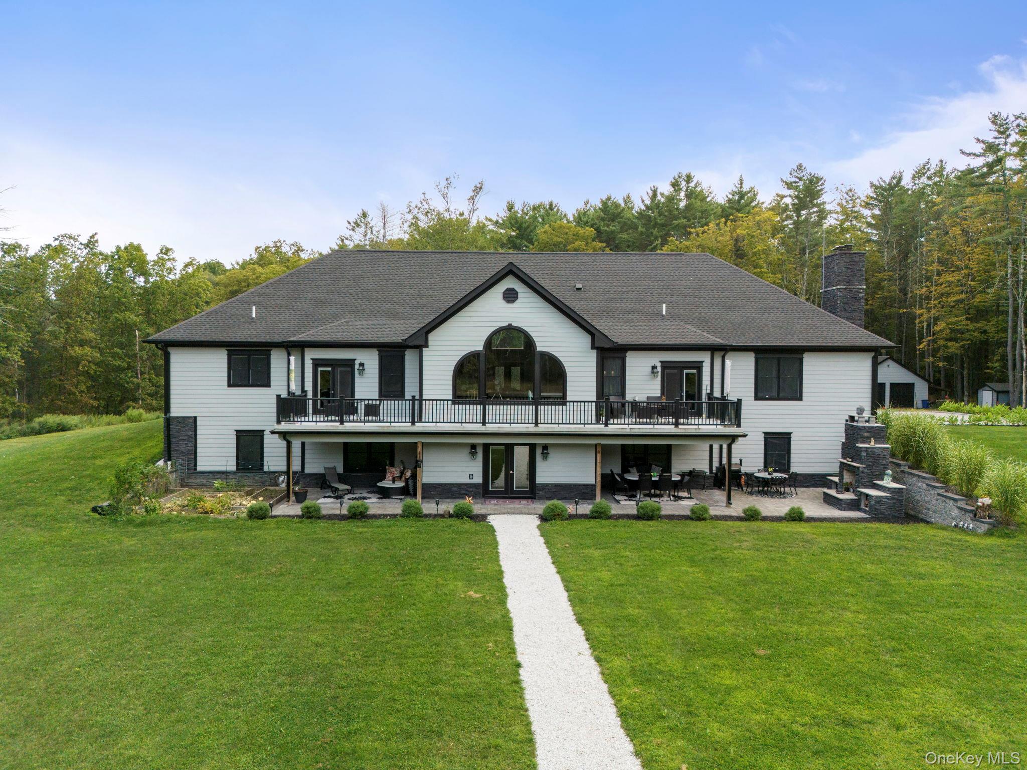 174 Webber Road Coxsackie, NY 12058 - Photo 43 of 50 a aerial view of a house with a yard table and chairs