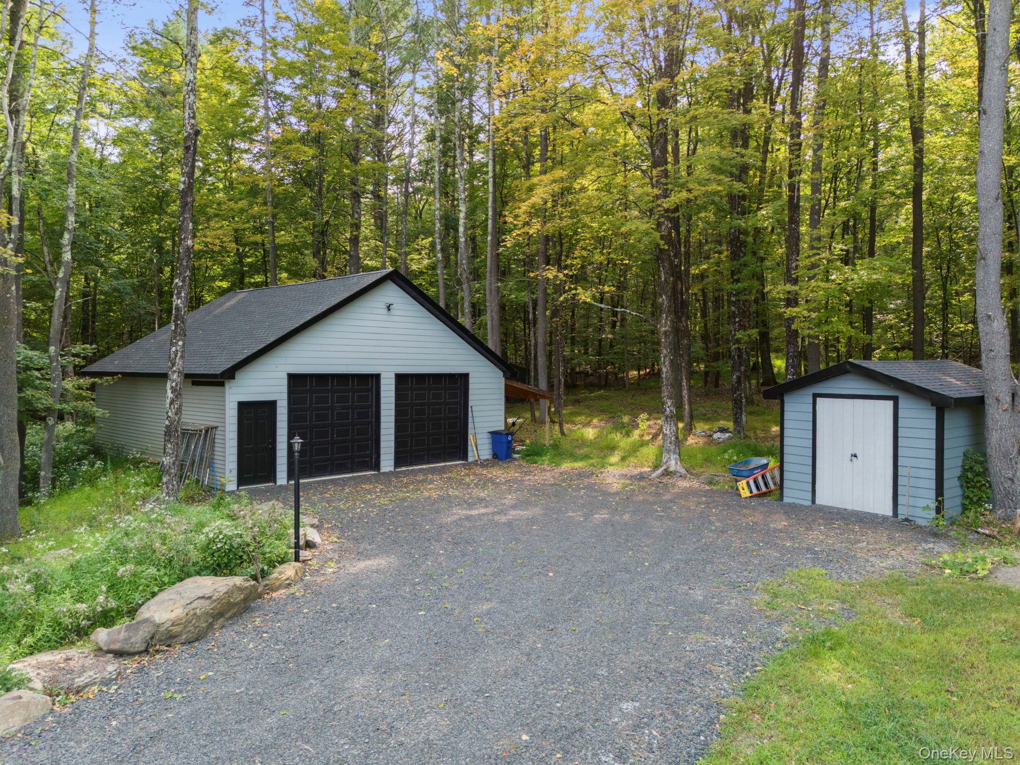 174 Webber Road Coxsackie, NY 12058 - Photo 47 of 50 a front view of a house with a yard and garage