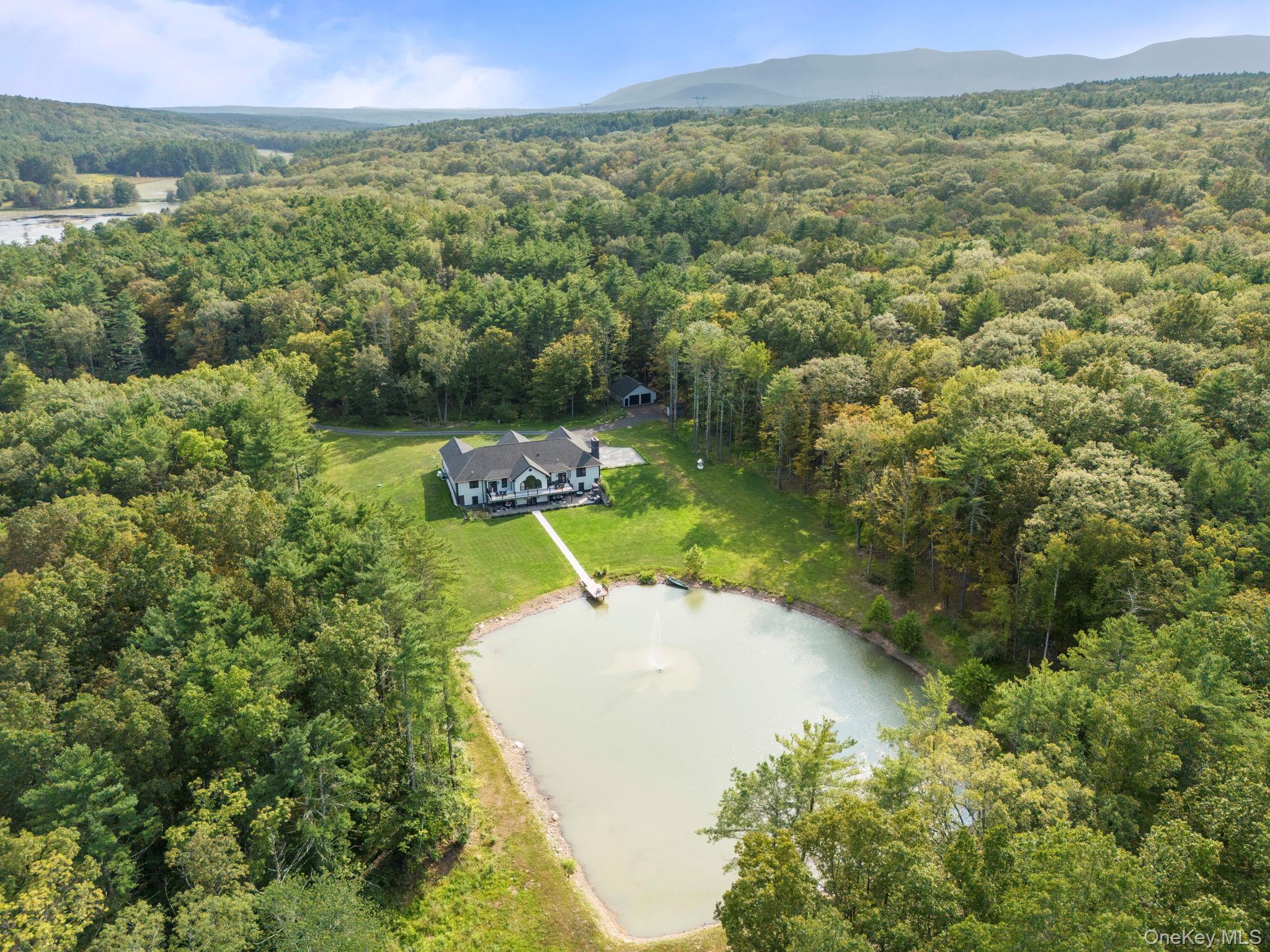 174 Webber Road Coxsackie, NY 12058 - Photo 49 of 50 a view of a field with an ocean and trees in the background