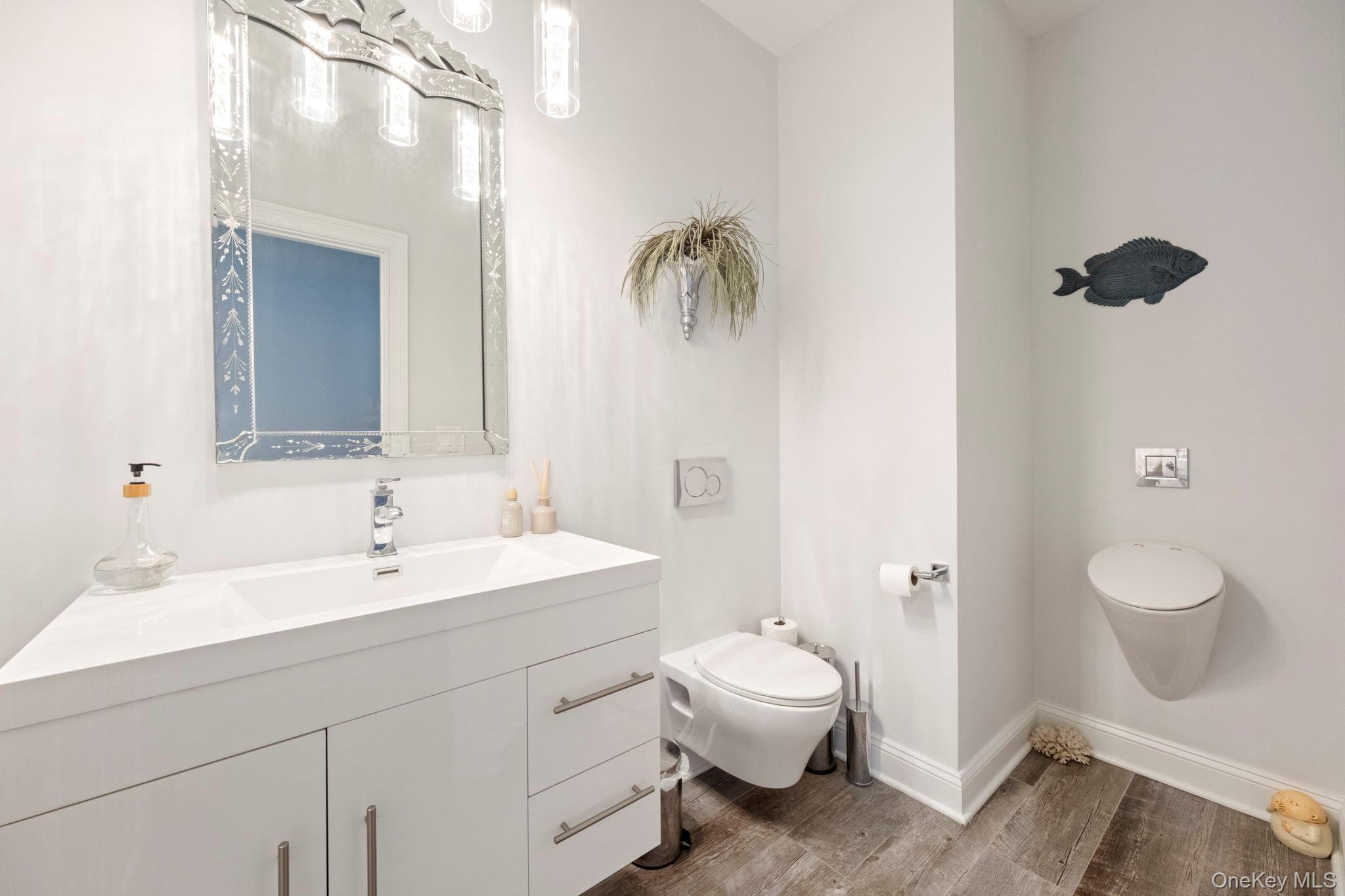 174 Webber Road Coxsackie, NY 12058 - Photo 7 of 50 a spacious bathroom with a toilet sink and mirror