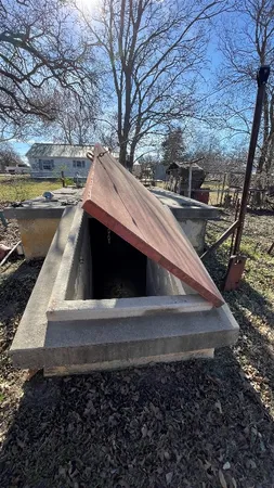 a view of a house with a yard covered in snow