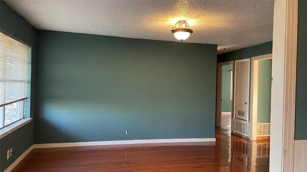 a kitchen with granite countertop a stove and a refrigerator