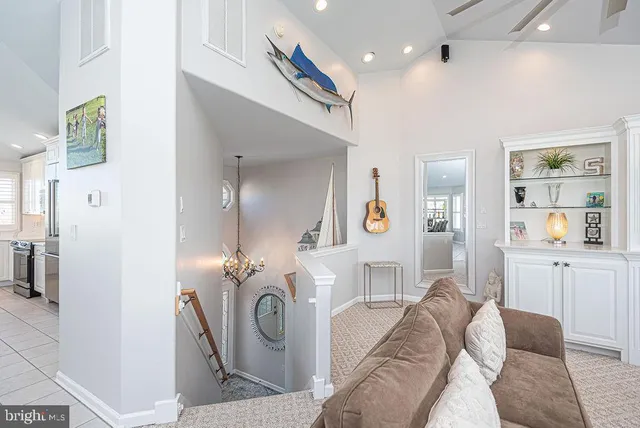 a living room with furniture rug and window
