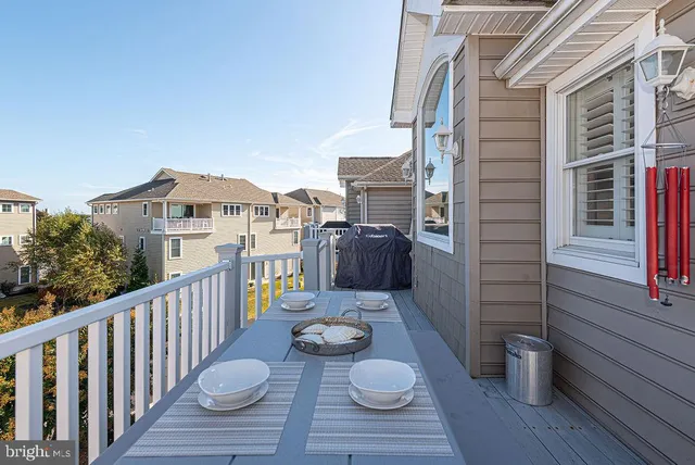 a bedroom with a bed and a flat tv screen on dresser